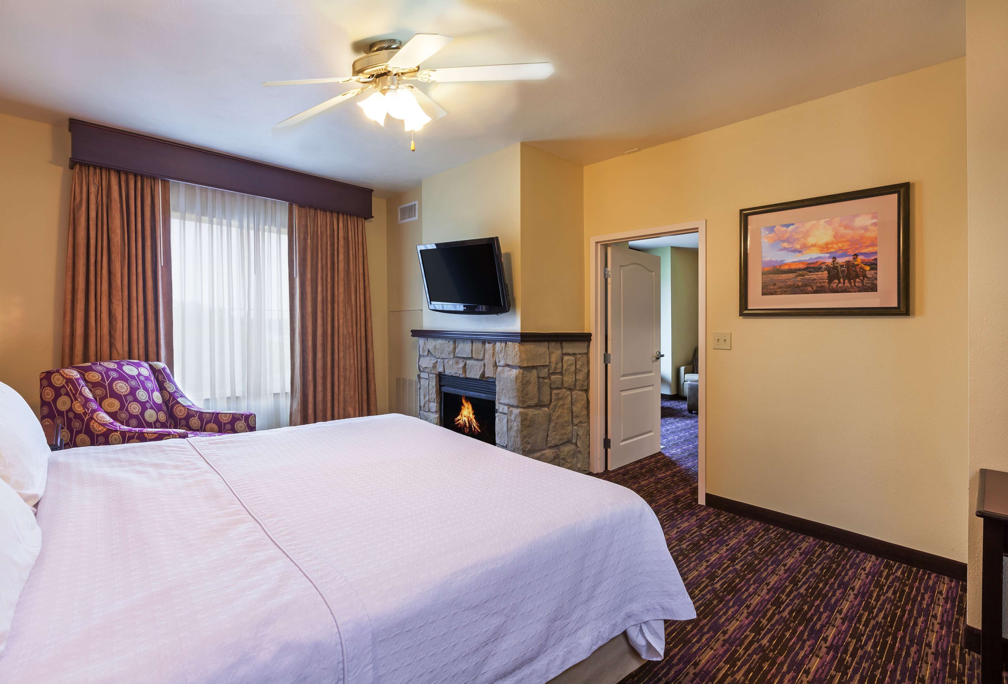 suite, 1 king bed, fireplace | in-room safe, desk, iron/ironing board, free rollaway beds