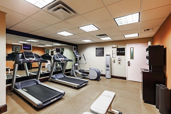A gym with treadmills, elliptical machines, and a bench. - Homewood Suites by Hilton Wichita Falls (Wichita Falls)