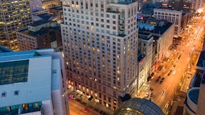 A high-rise hotel with multiple floors and a prominent "CONRAD" sign at the top. - Conrad Indianapolis (Indianapolis)