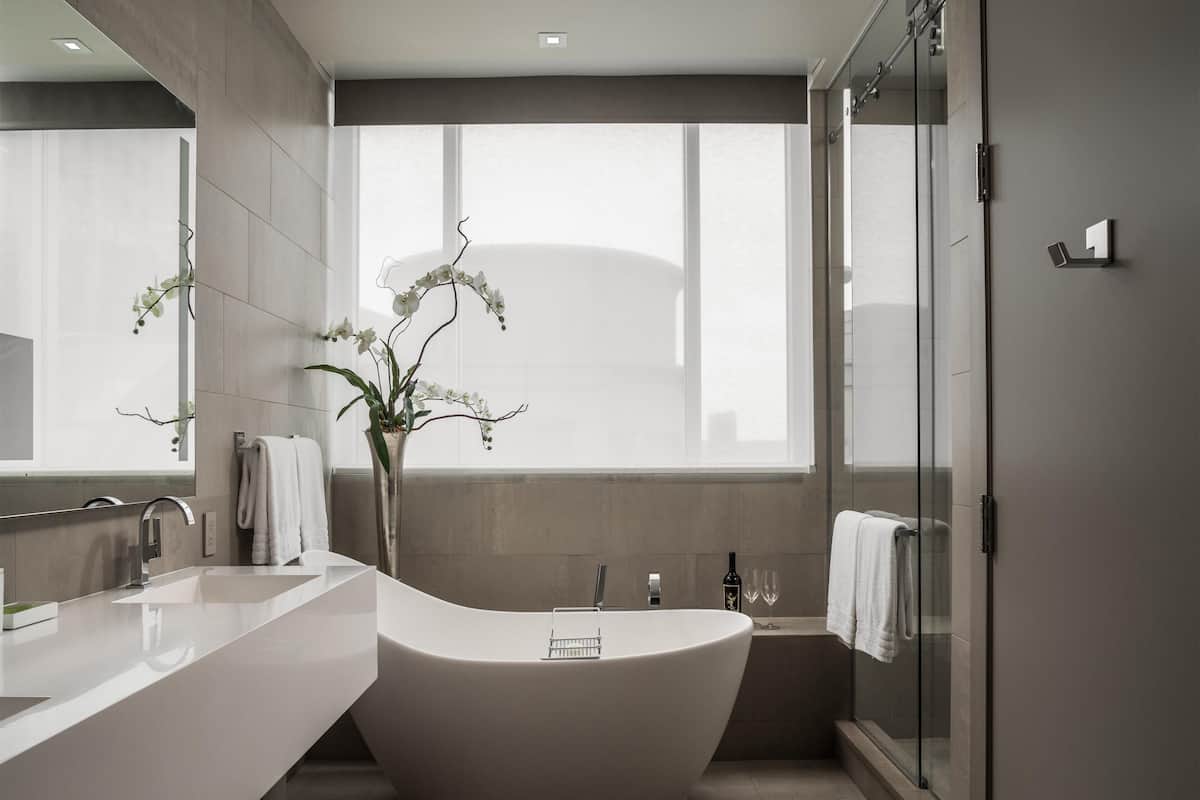 Suite, 1 King Bed (Modernism Collection) | Bathroom | Separate bathtub and shower, deep-soaking bathtub, rainfall showerhead