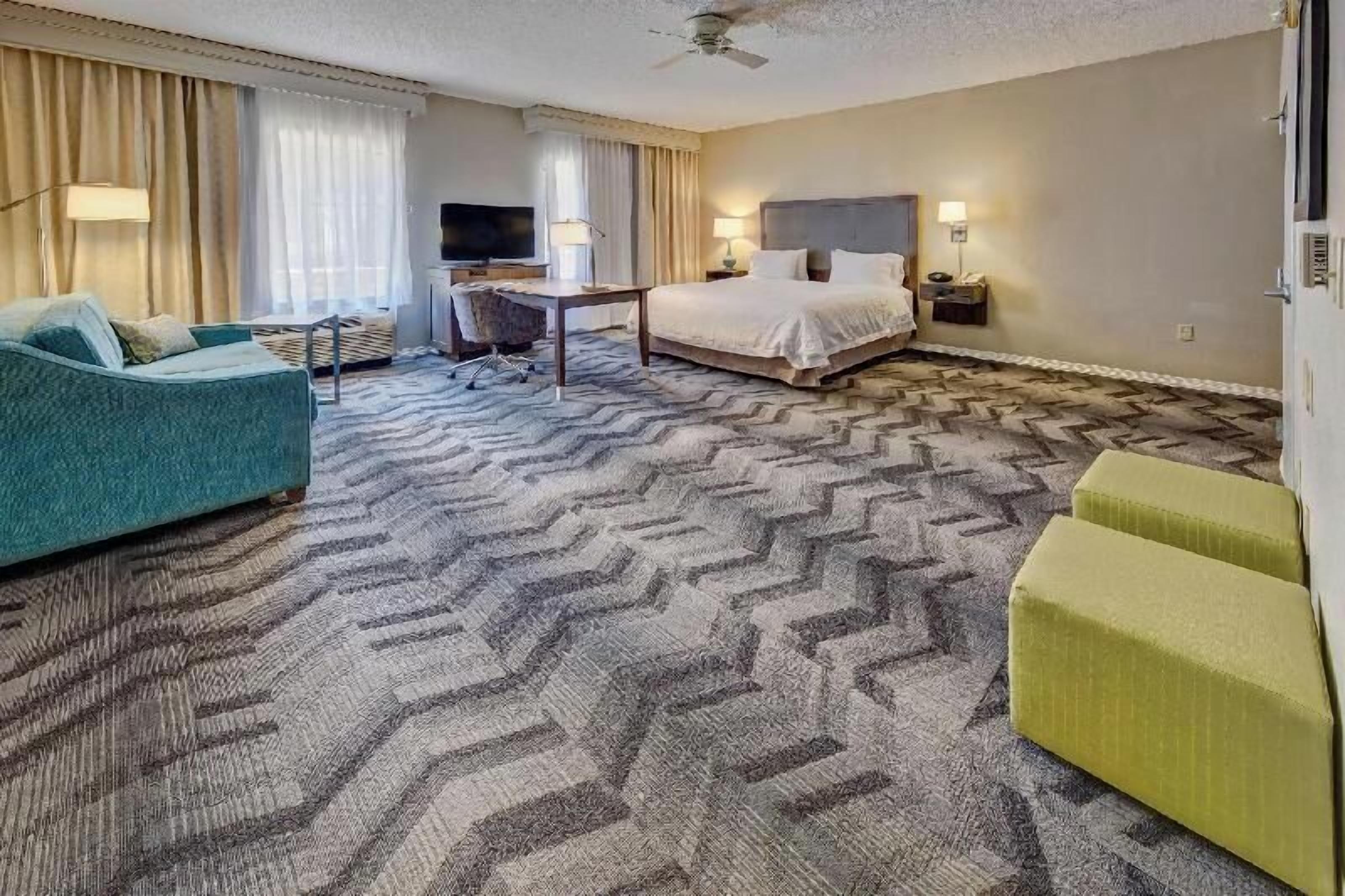 Premium bedding, desk, laptop workspace, blackout curtains