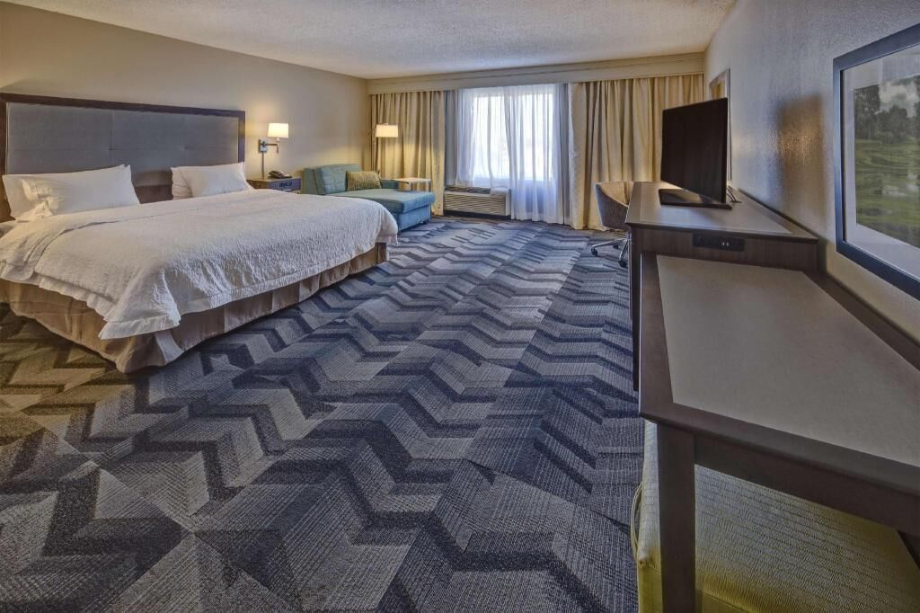 Premium bedding, desk, laptop workspace, blackout curtains