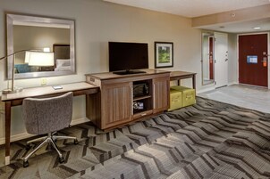 Premium bedding, desk, laptop workspace, blackout drapes