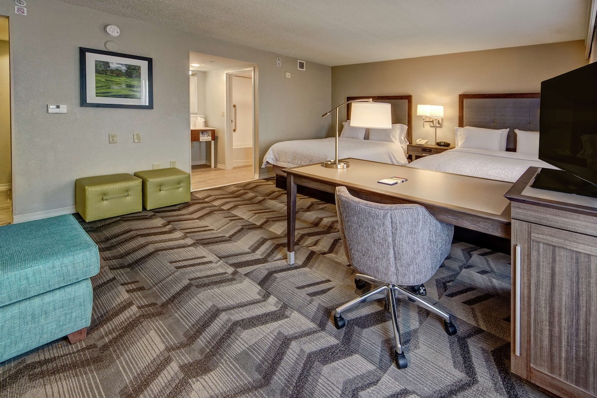 Premium bedding, desk, laptop workspace, blackout curtains
