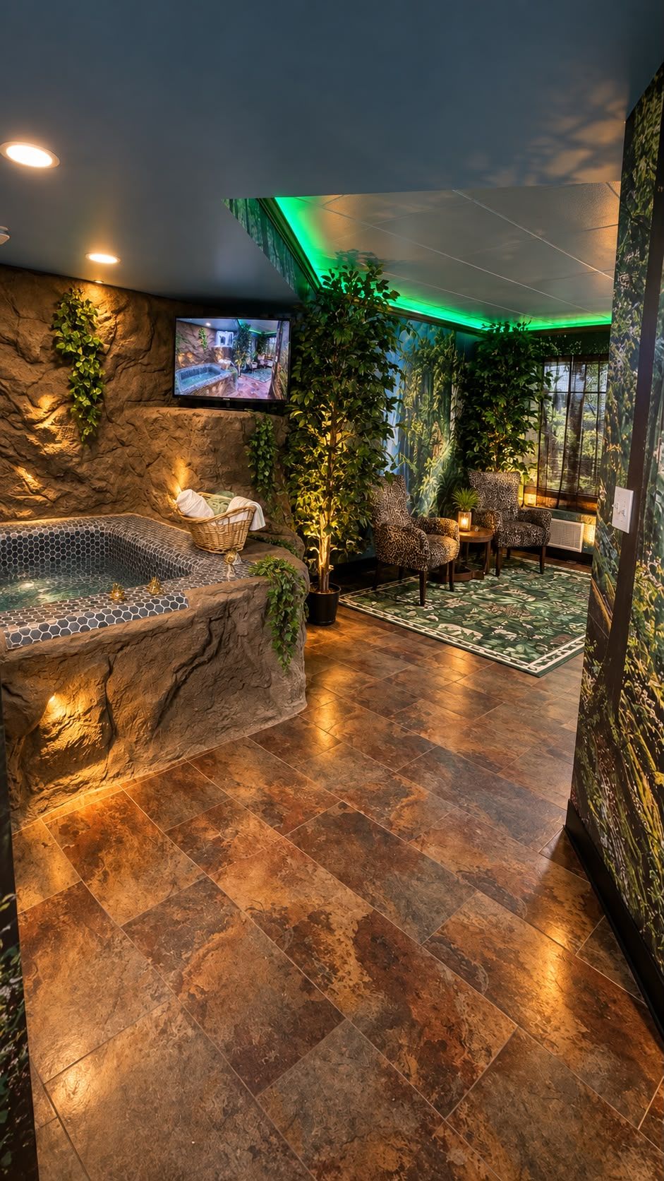 A spa area with a hot tub, seating, and a television screen.