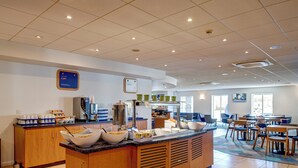 A breakfast area with a buffet setup, including bowls of cereal and a coffee station. - Holiday Inn Express Newcastle Gateshead by IHG (Newcastle-upon-Tyne)