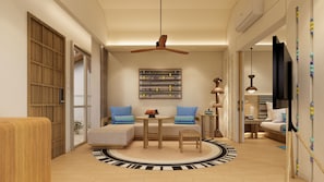 Deluxe Suite (Garden) | Living area | 32-inch LCD TV with satellite channels, TV, DVD player