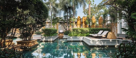 2 outdoor pools, open 6:00 AM to 7:00 PM, pool umbrellas, pool loungers