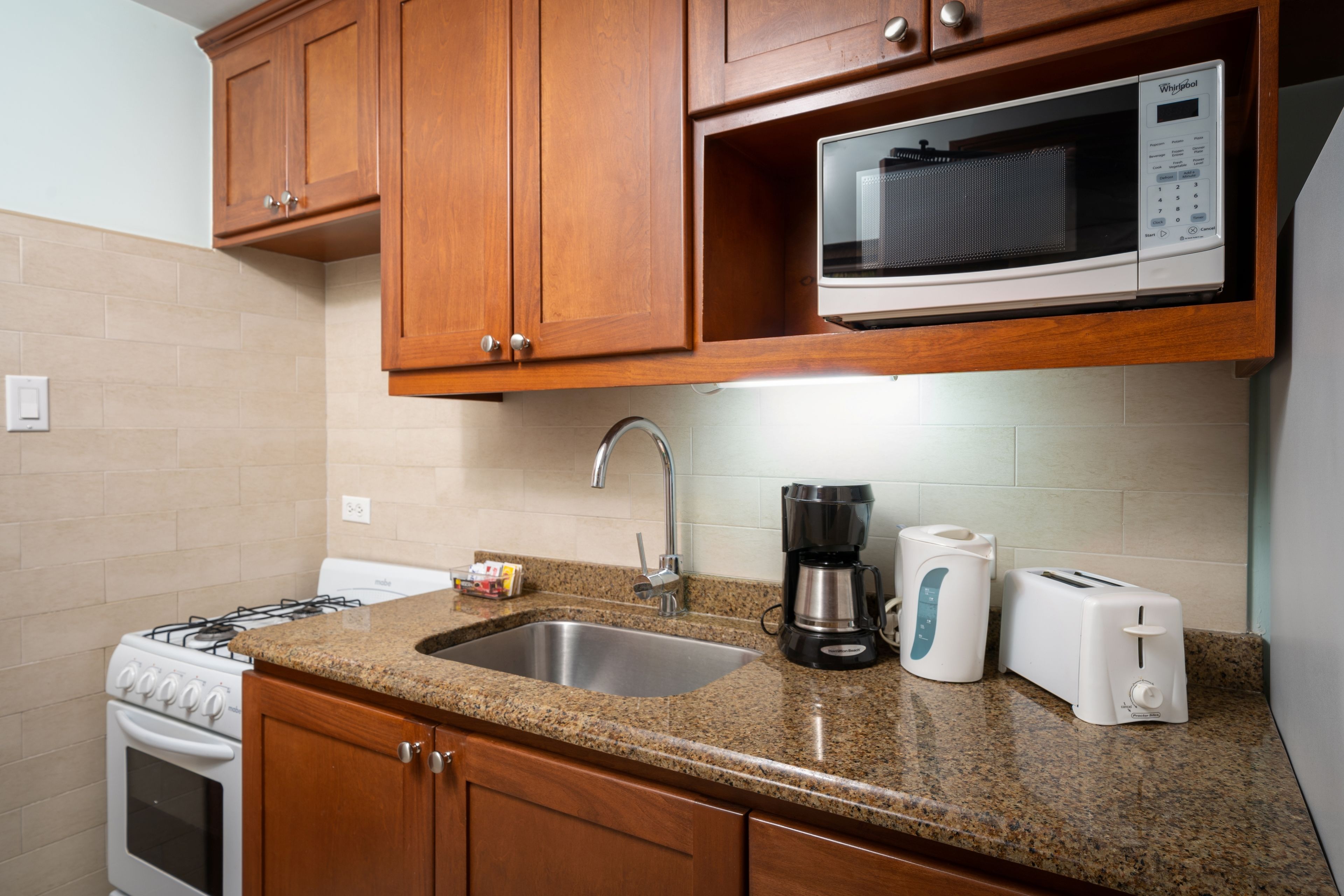 deluxe studio, 1 king bed with sofa bed, sea view | private kitchen | full-sized fridge, microwave, oven, stovetop