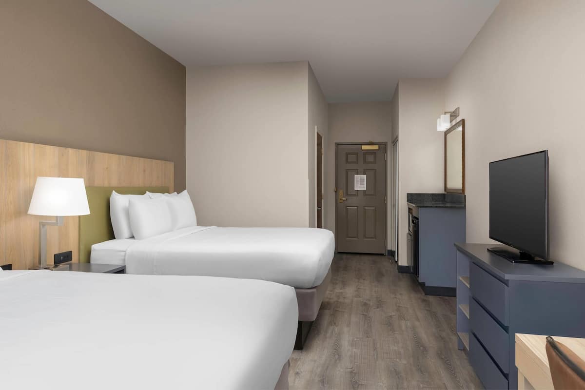 Room, 2 Queen Beds, Non Smoking | Pillow-top beds, desk, laptop workspace, blackout curtains