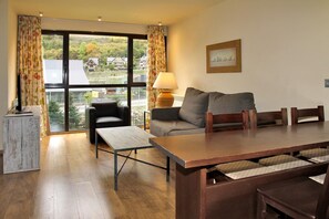 Family Quadruple Room, Mountain View (2 Bathrooms) | Living room | LCD TV