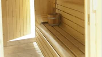 A wooden sauna room with benches, a wooden door, and a wall-mounted clock.