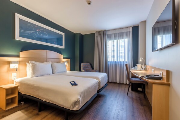 Desk, blackout curtains, free WiFi, bed sheets