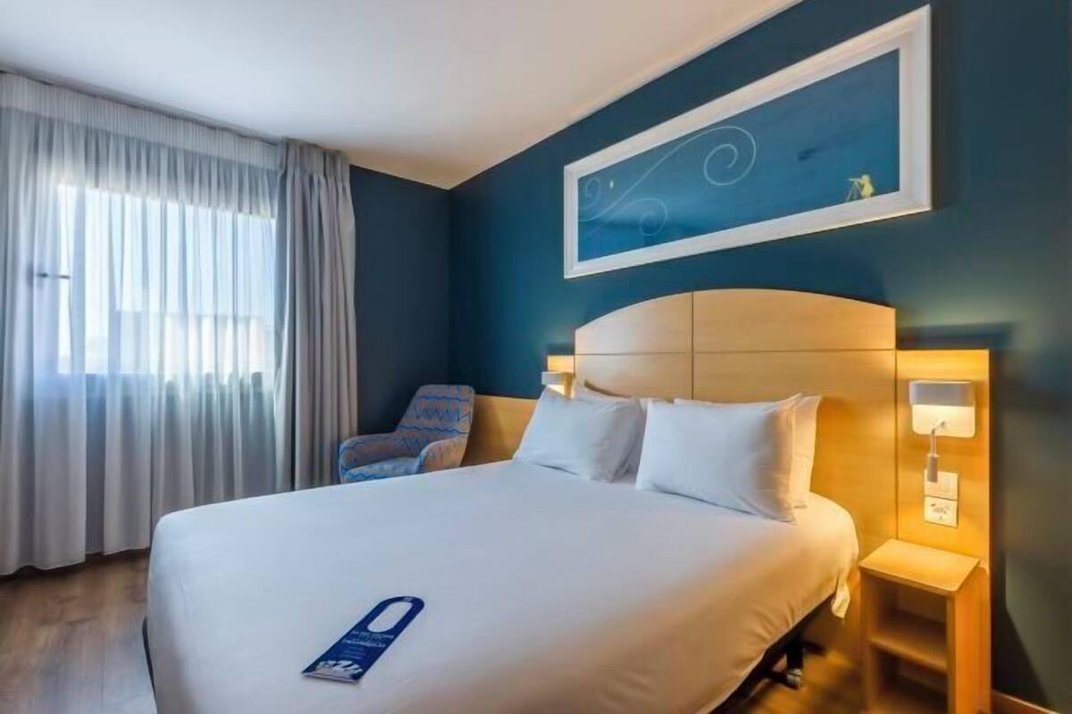 Desk, blackout curtains, free WiFi, bed sheets