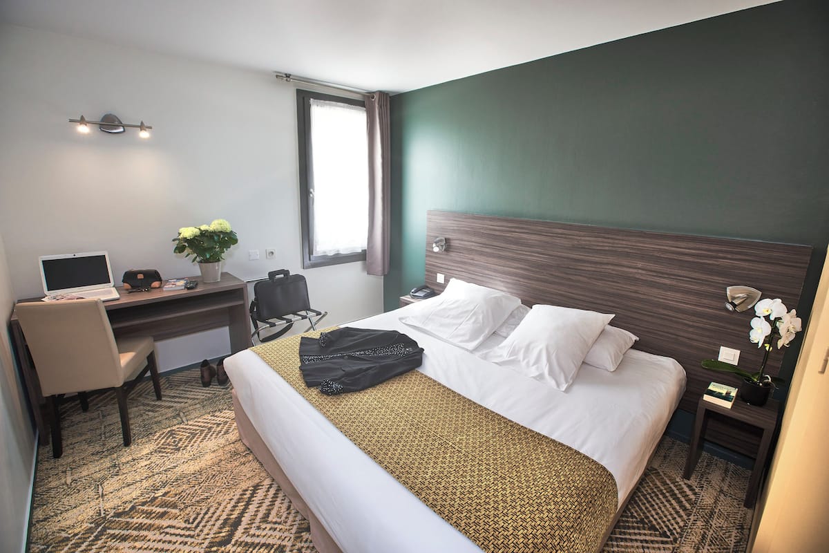 Premium bedding, desk, laptop workspace, blackout curtains