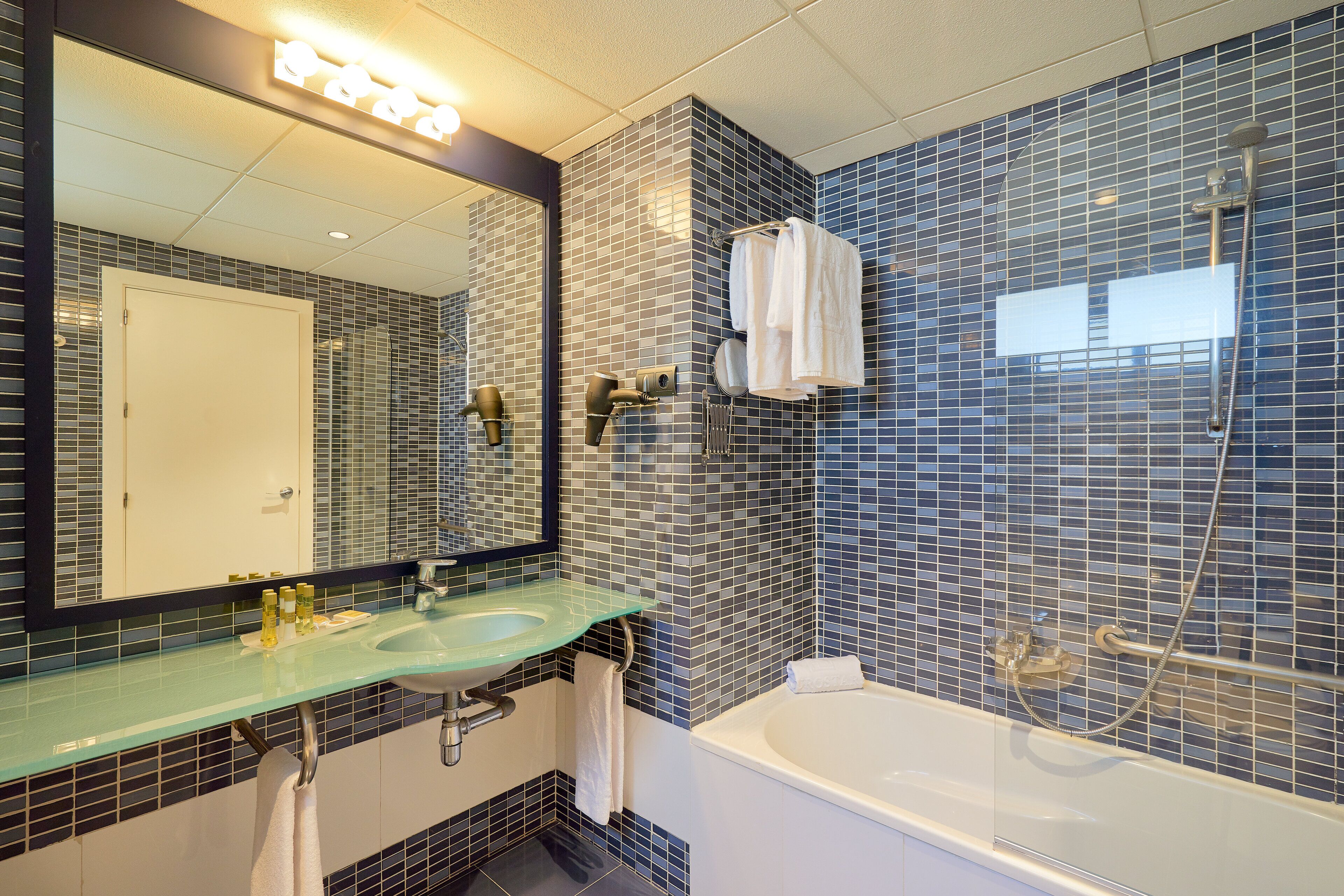 combined shower/bathtub, designer toiletries, hair dryer, bidet