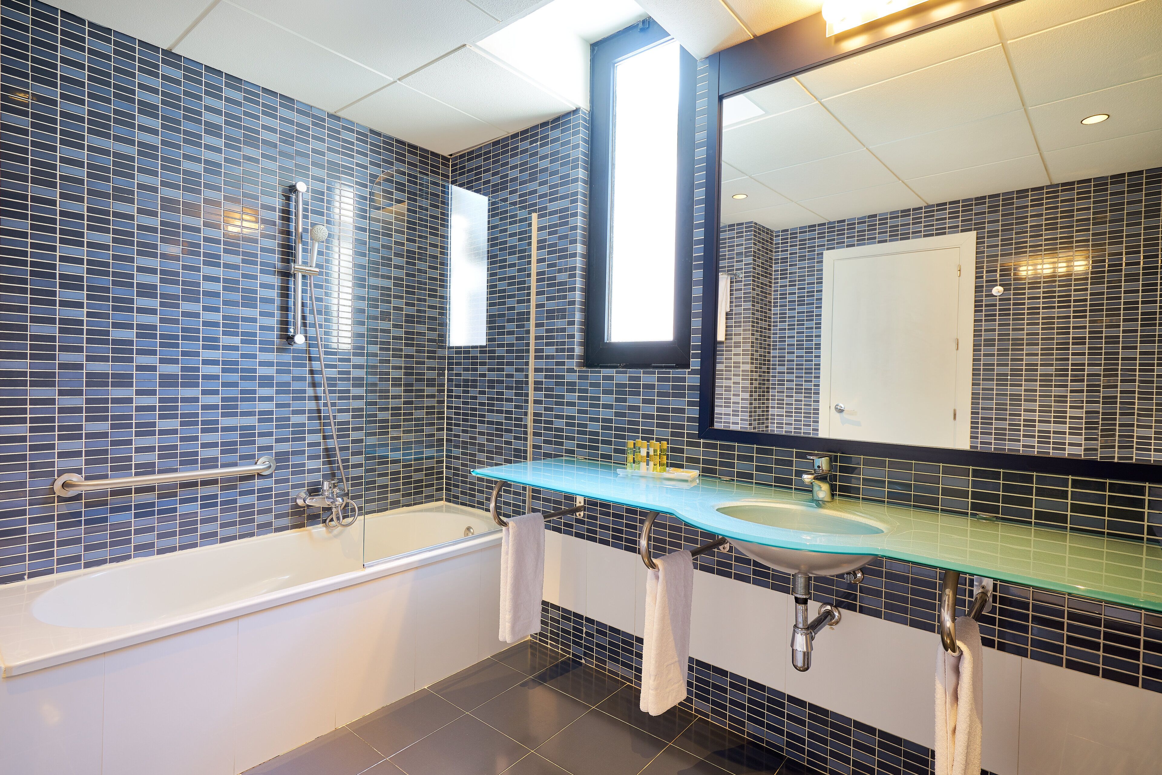 combined shower/bathtub, designer toiletries, hair dryer, bidet