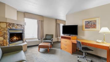 Suite, 1 King Bed, Refrigerator | Living area