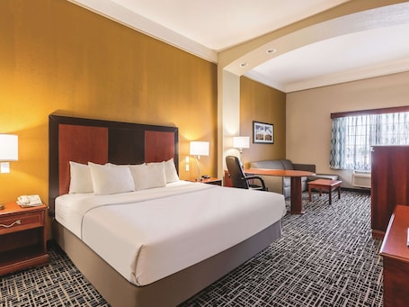 Deluxe Suite, 1 King Bed, Non Smoking | Premium bedding, desk, blackout drapes, iron/ironing board