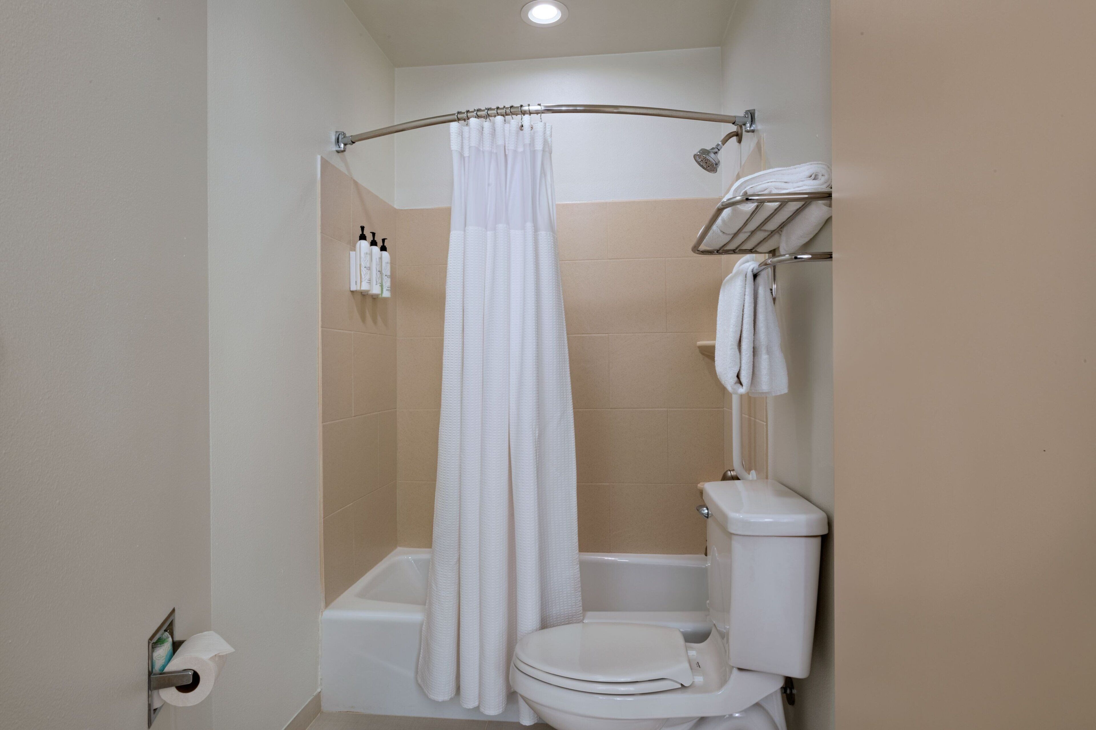 designer toiletries, hair dryer, towels, soap