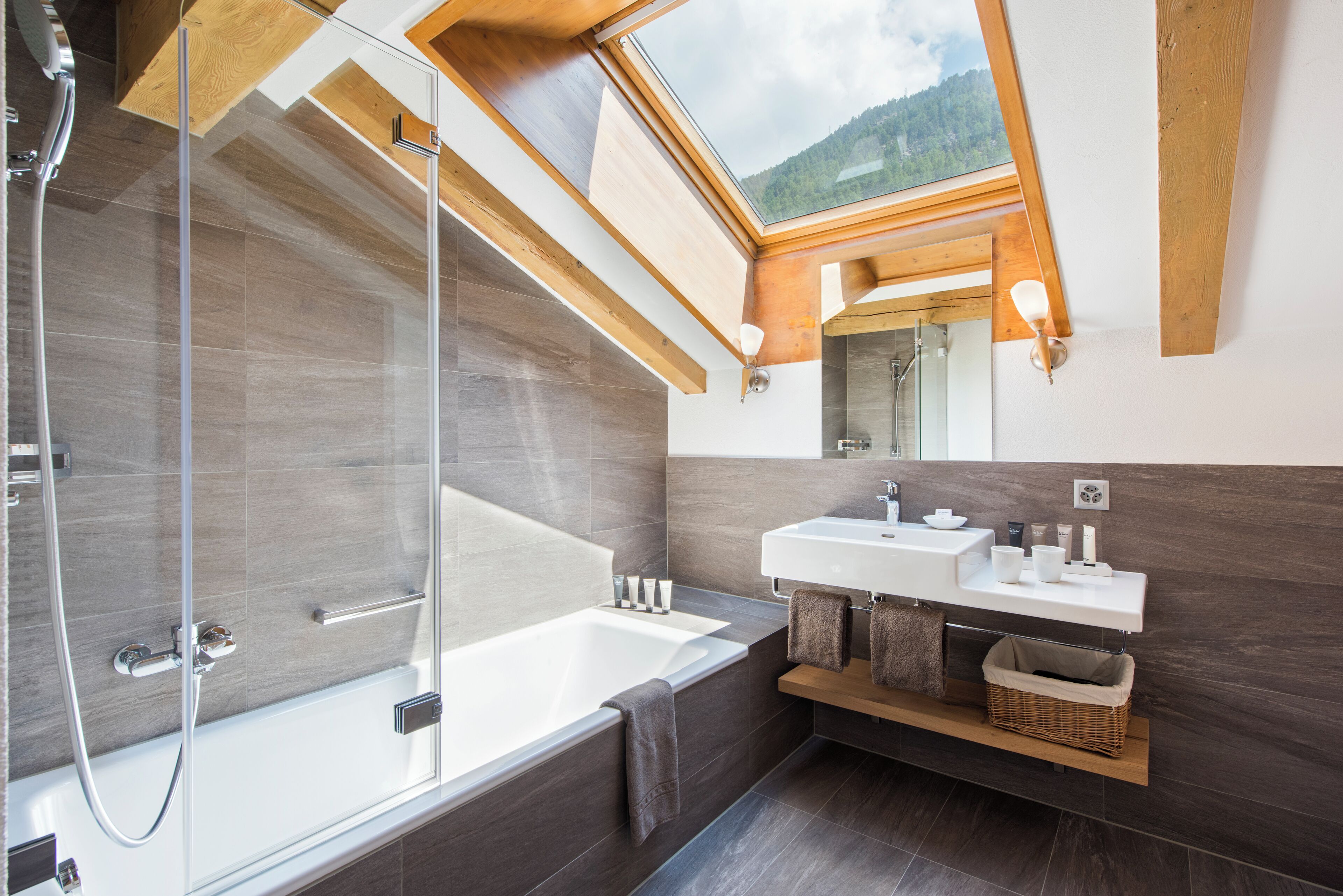 alpine matterhorn suite | bathroom | combined shower/bathtub, free toiletries, hair dryer, slippers