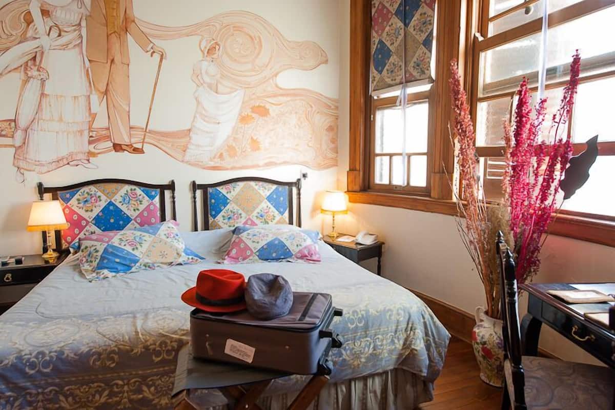 Habitación superior | Ropa de cama de alta calidad y edredones de plumas