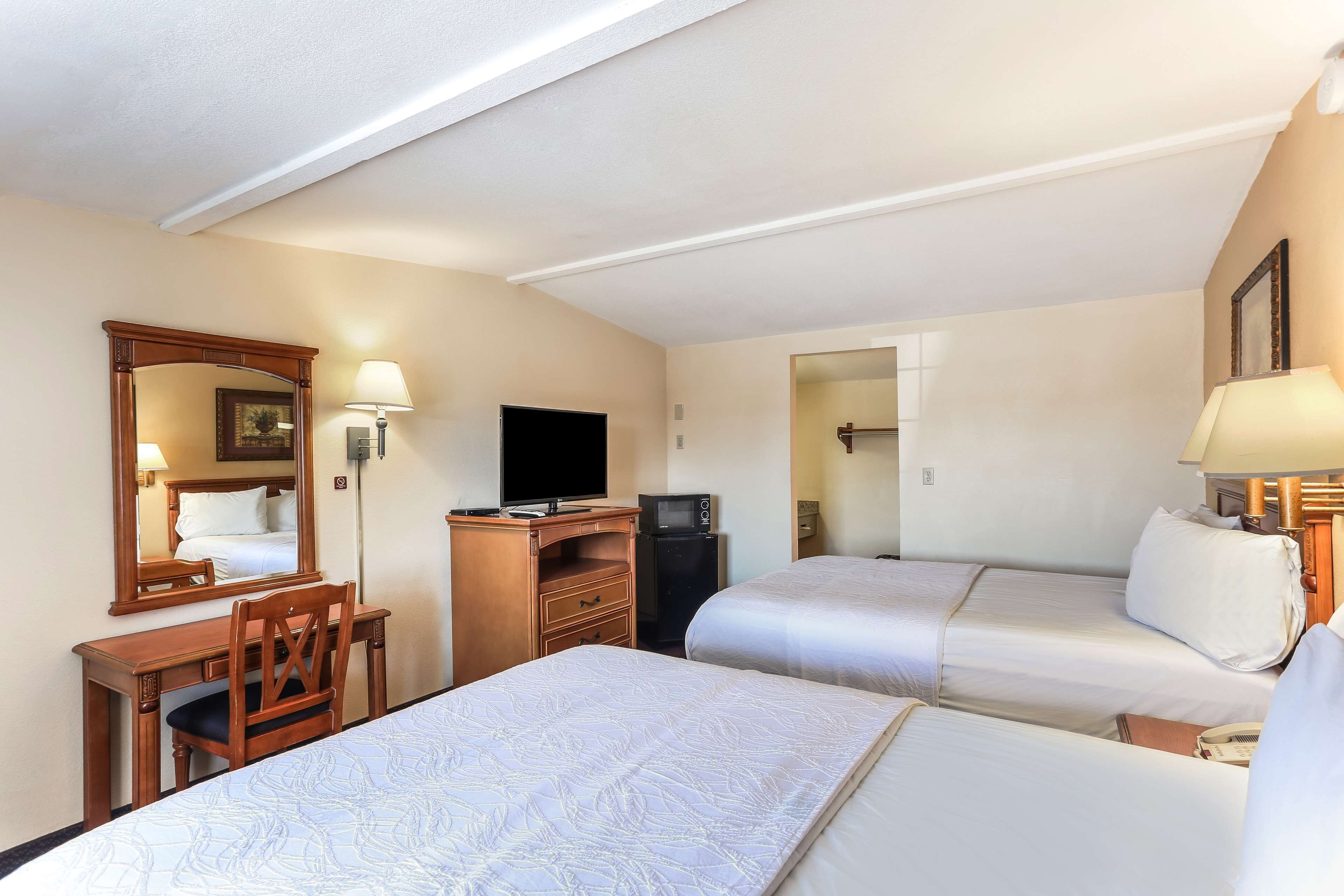 Desk, blackout curtains, iron/ironing board, rollaway beds