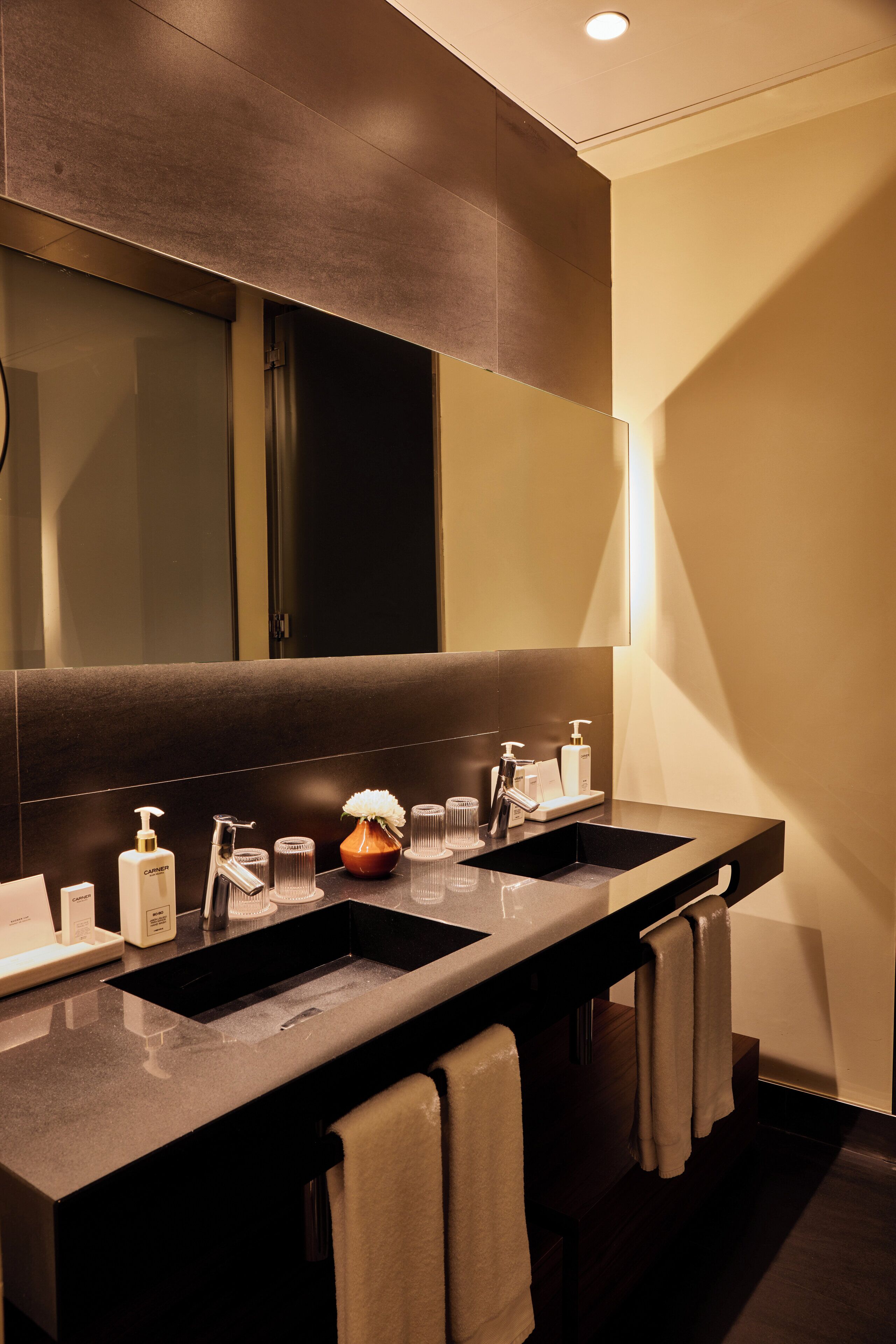 master suite | bathroom | combined shower/bathtub, designer toiletries, hair dryer, bathrobes