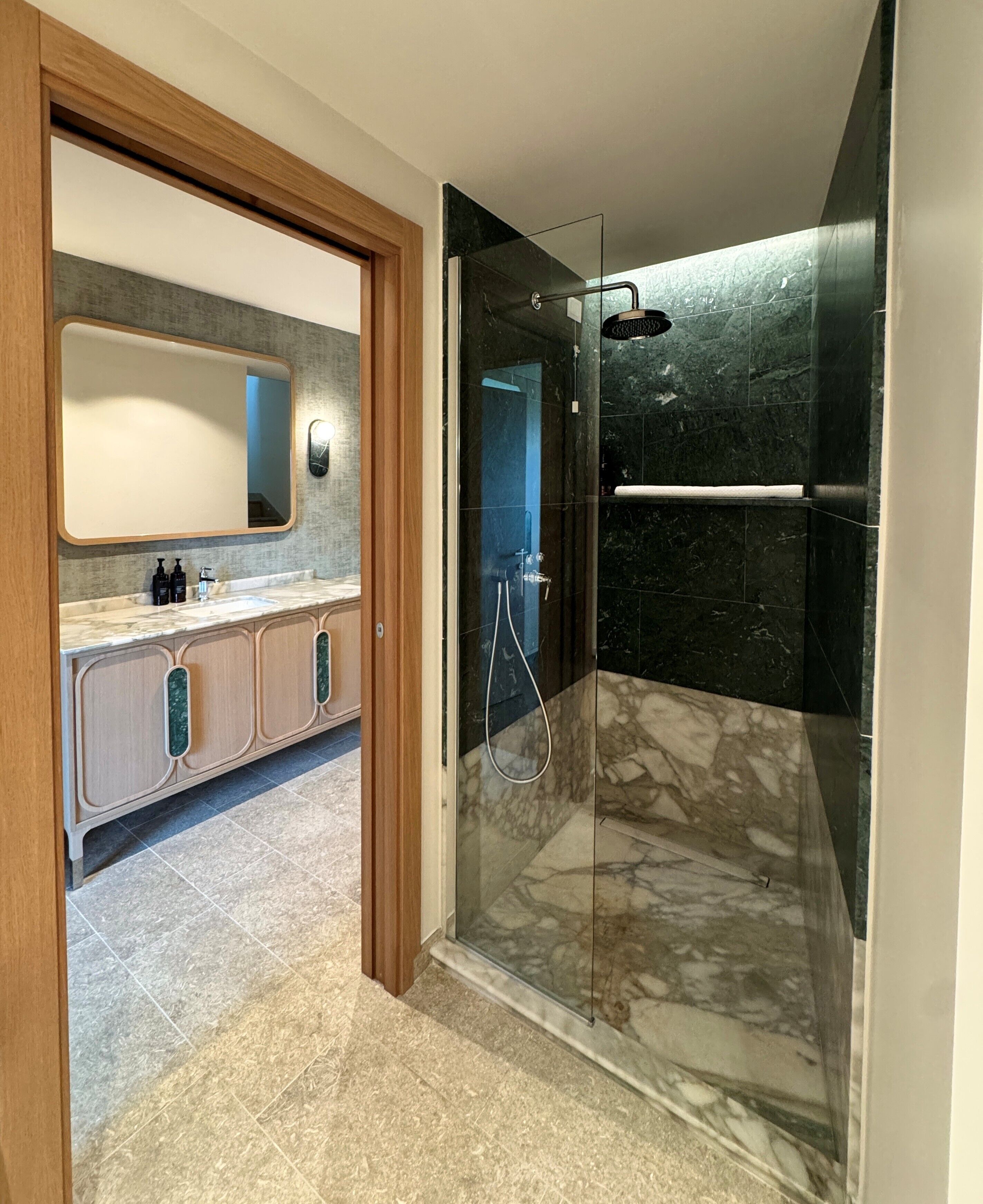 family suite | bathroom | shower, rainfall showerhead, hair dryer, slippers