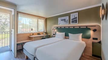 Luxe beddengoed, een bureau, verduisterende gordijnen, gratis wifi
