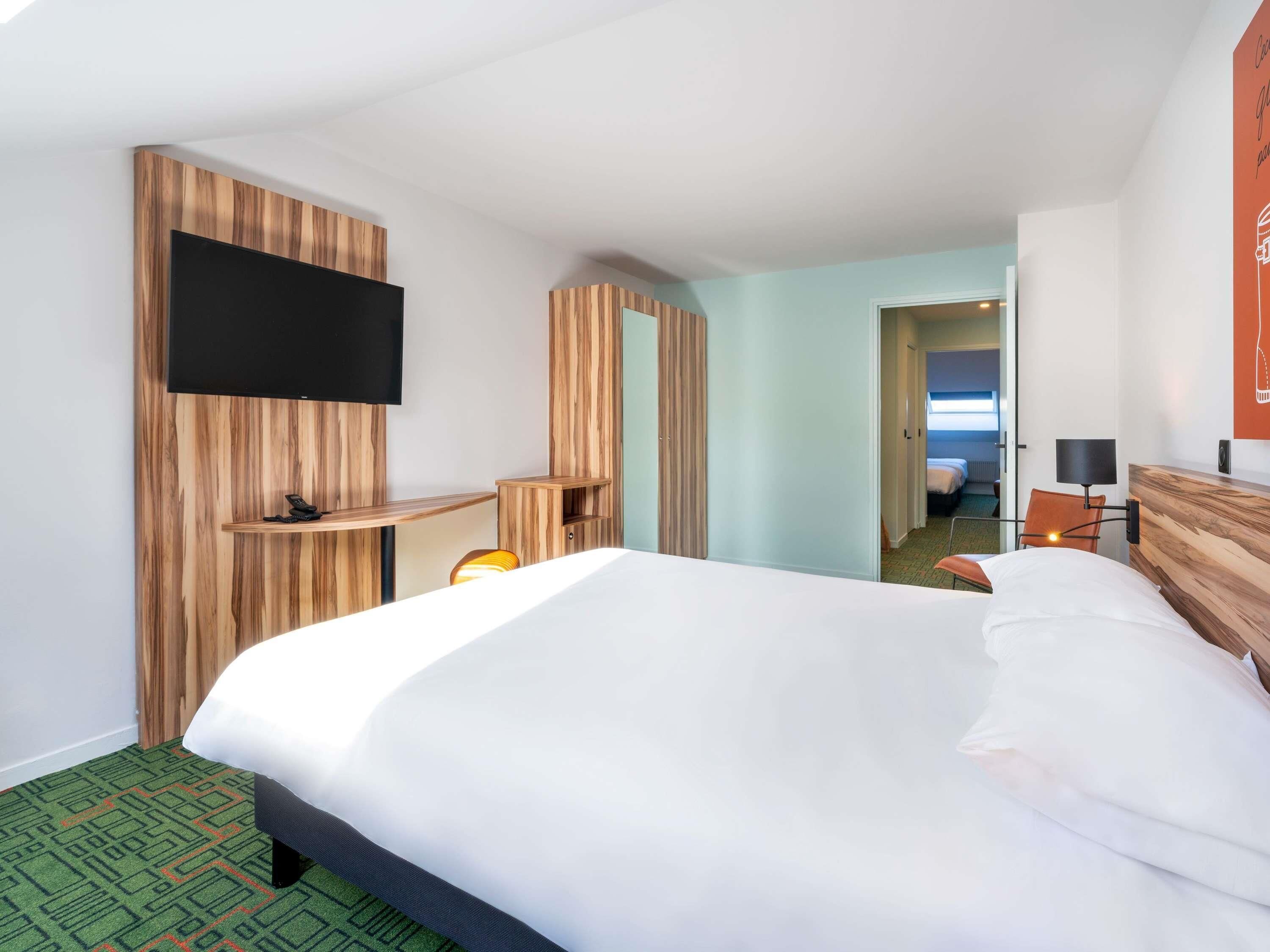 premium bedding, select comfort beds, desk, laptop workspace