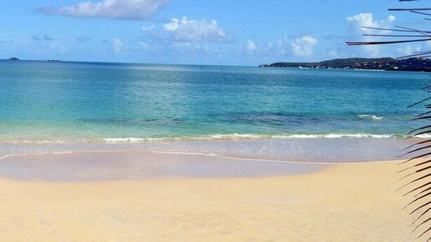 A beach with clear turquoise water and a sandy shore. - Atlantic Breeze Inn (Old Orchard Beach)