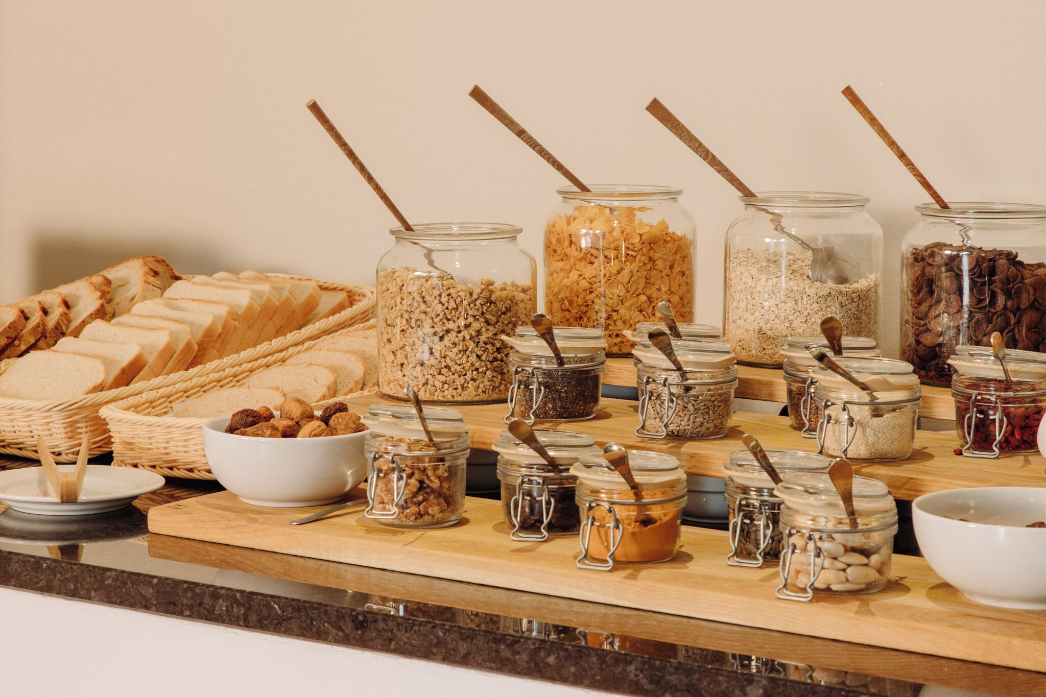 A buffet with various food items and utensils.