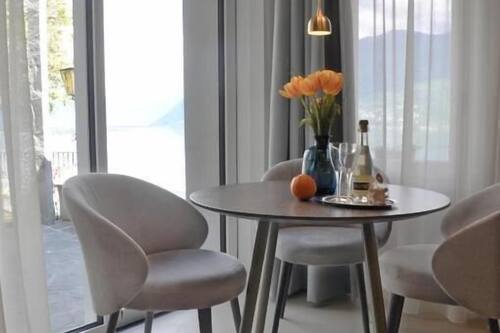Luxury Suite, Balcony, Lake View | Dining | Breakfast and dinner served