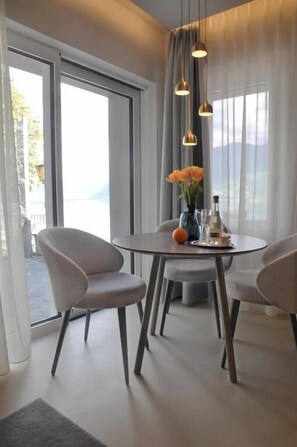 Luxury Suite, Balcony, Lake View | Dining | Breakfast and dinner served, beach views - Boutique Hotel La Rocca (Ronco sopra Ascona)