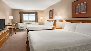 A hotel room with two beds, a desk, a chair, a TV, and a window with a view. - Days Inn & Conference Centre by Wyndham Oromocto (Oromocto)