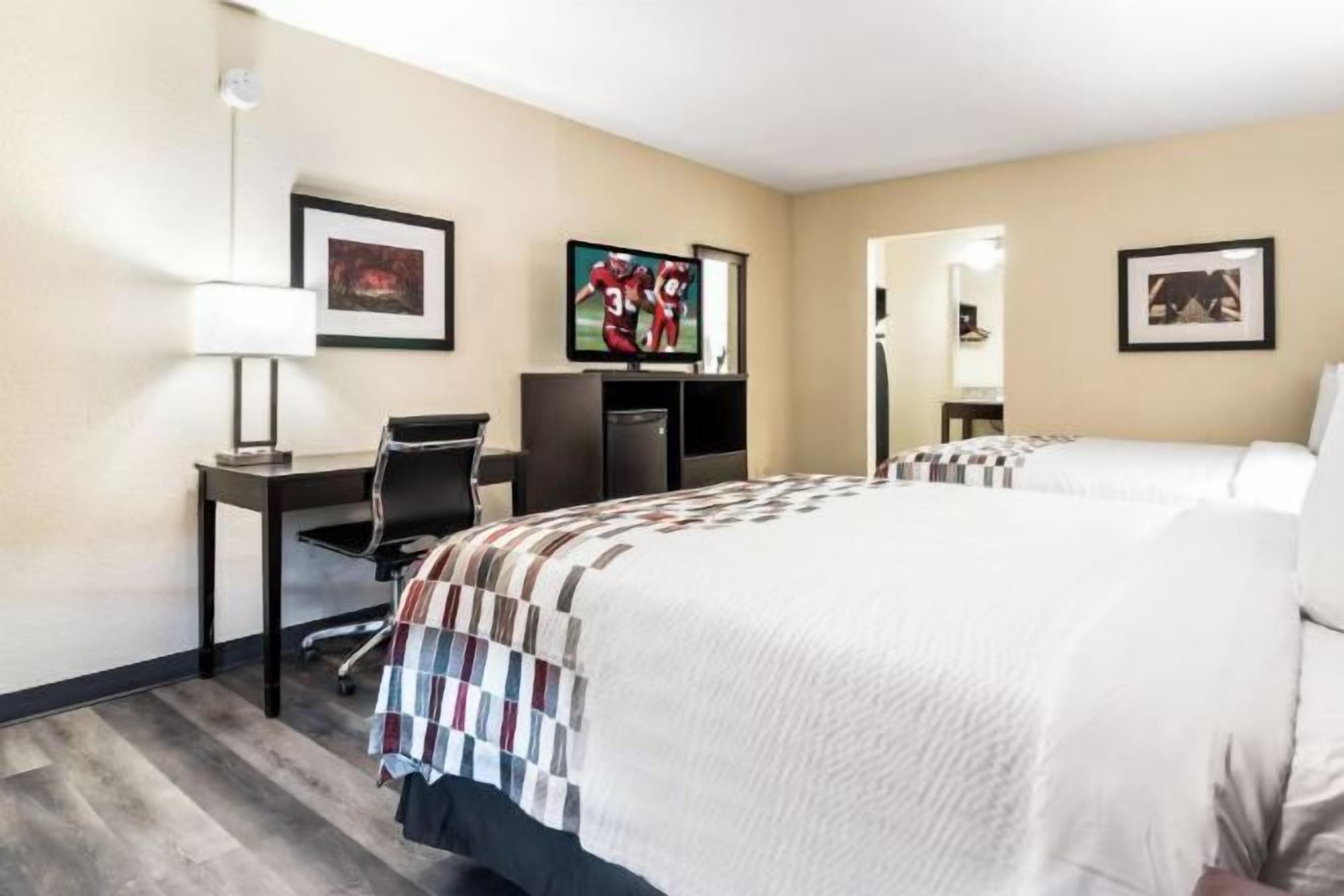 Desk, laptop workspace, blackout drapes, iron/ironing board