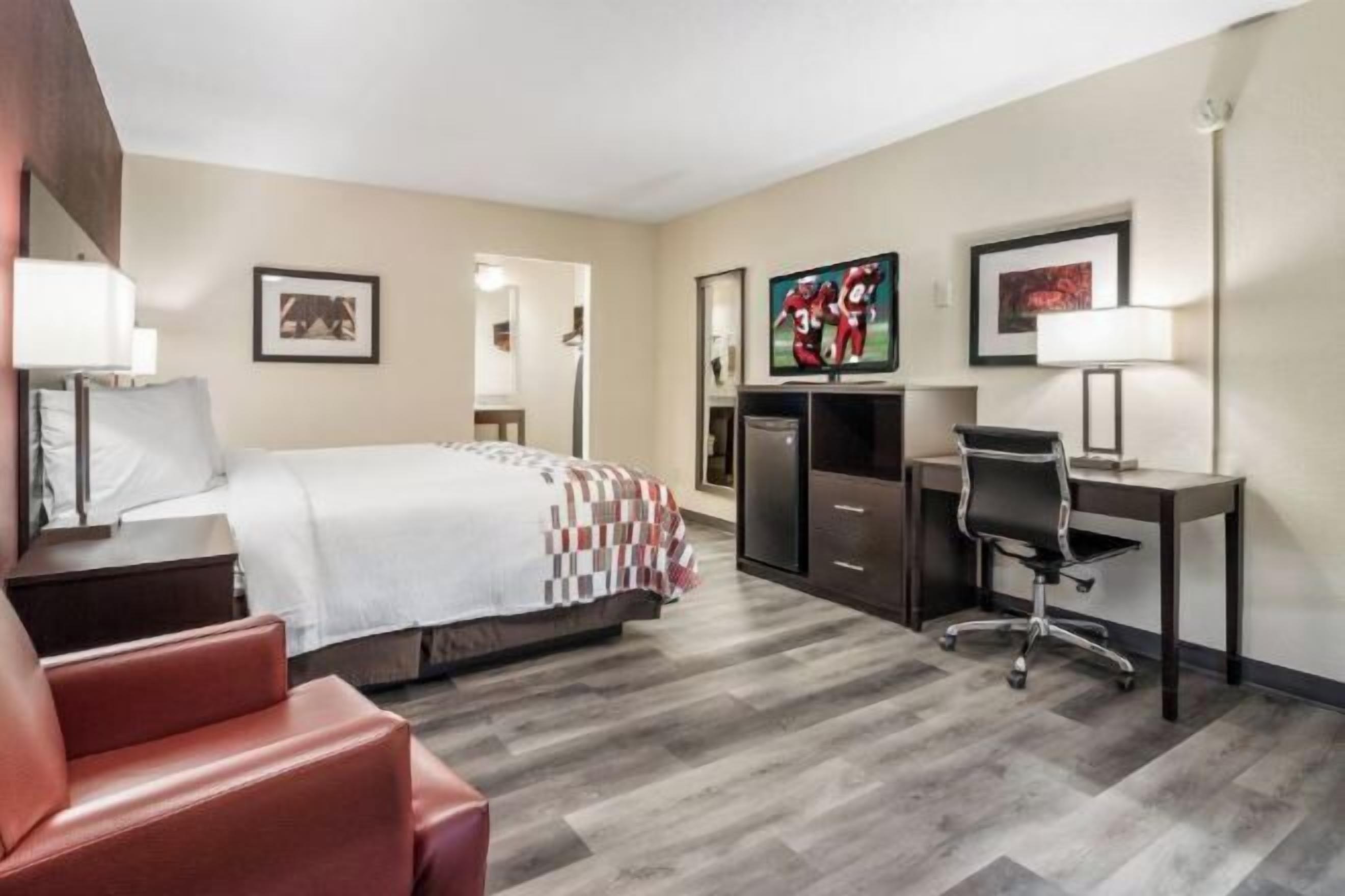 Desk, laptop workspace, blackout drapes, iron/ironing board