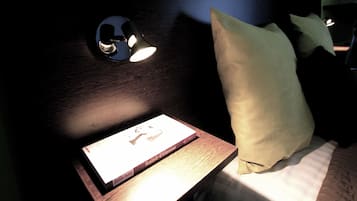 Premium bedding, blackout curtains, soundproofing, iron/ironing board
