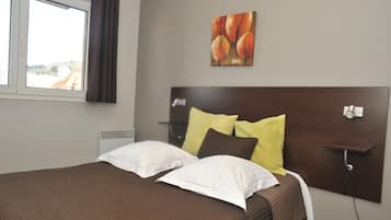 Premium bedding, blackout drapes, soundproofing, iron/ironing board