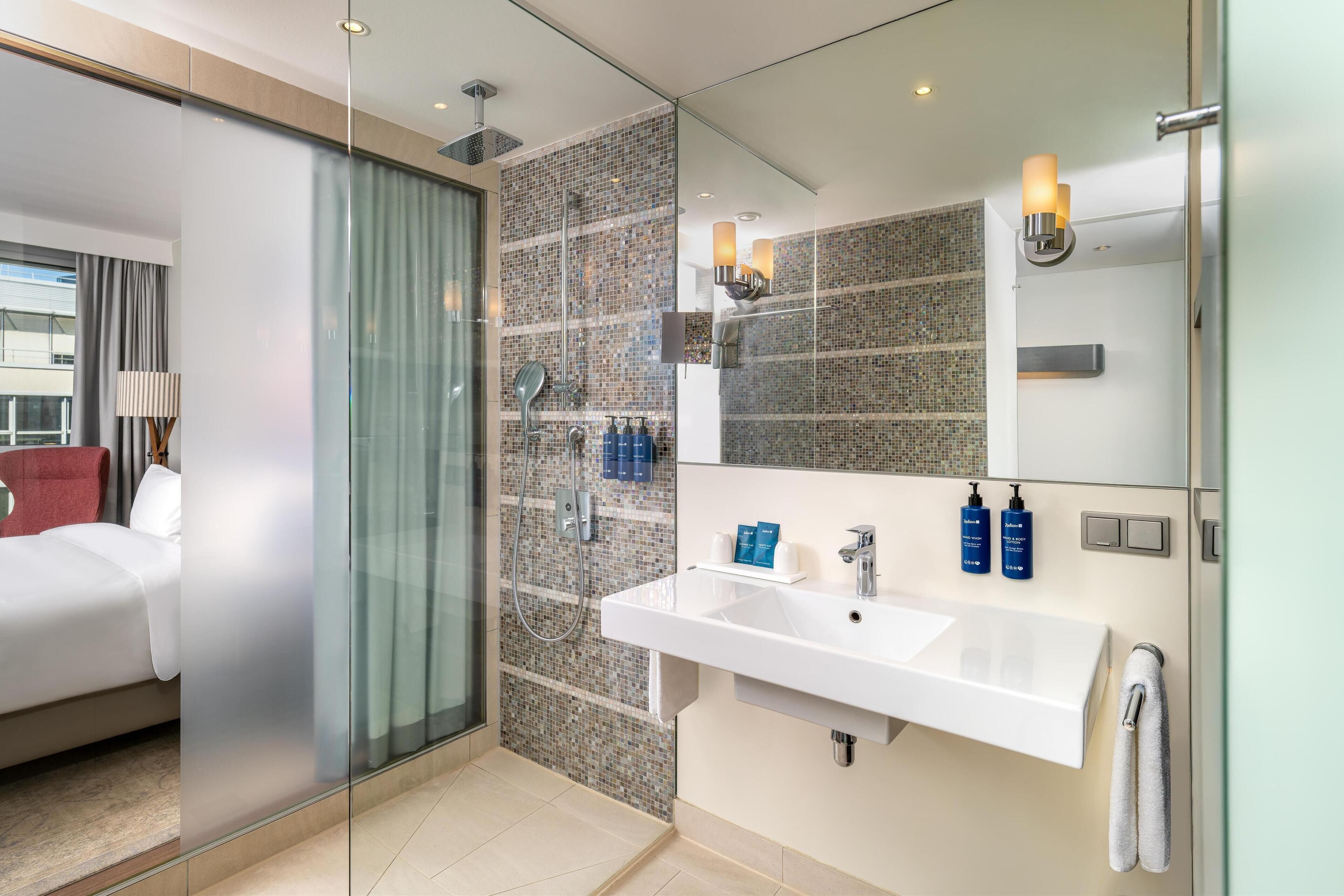 shower, eco-friendly toiletries, hair dryer, towels