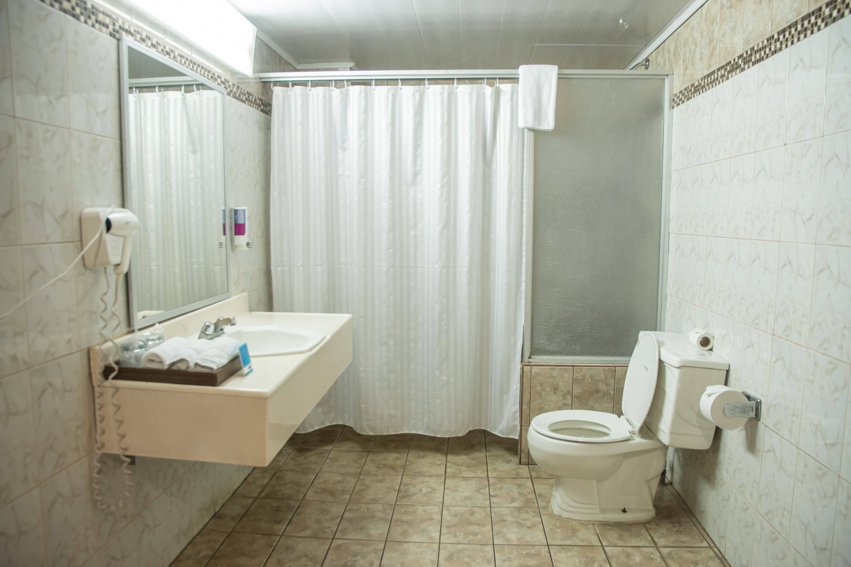 standard 1 beds | bathroom | shower, eco-friendly toiletries, hair dryer, towels