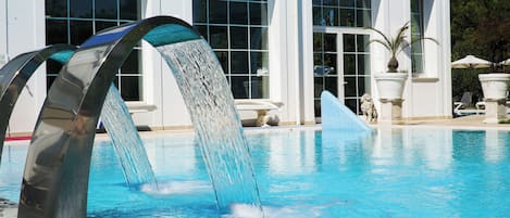 2 indoor pools, 2 outdoor pools, open 9 AM to 8 PM, pool umbrellas