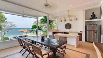 Four Bedroom Oceanfront Pool Residence | Living area | 43-inch LED TV with satellite channels, TV, fireplace