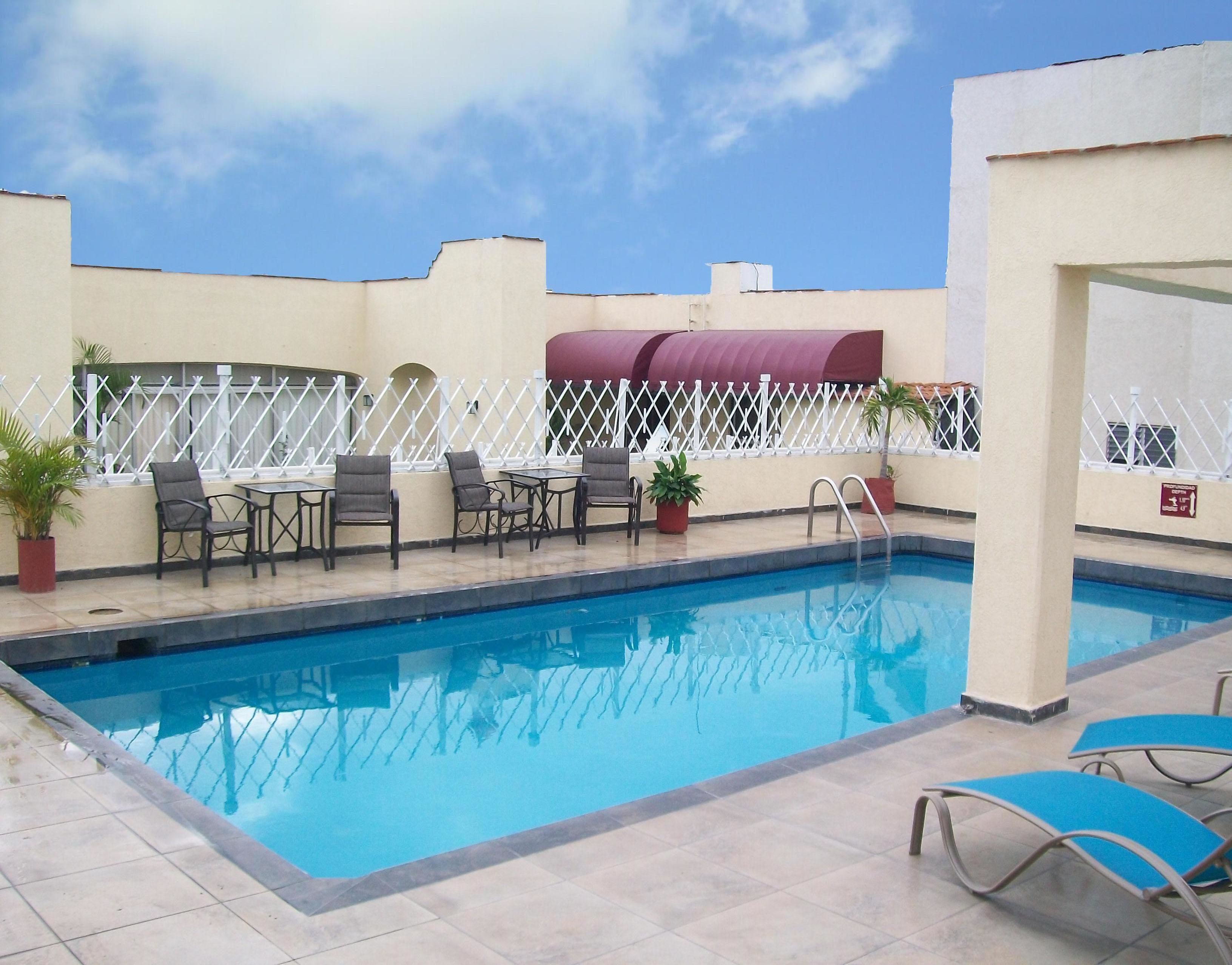 outdoor pool, open 8:30 am to 8:00 pm, pool loungers