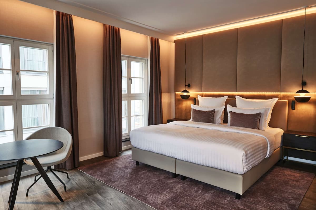 junior suite | hypo-allergenic bedding, down duvets, in-room safe, desk