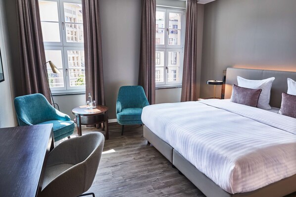 Hypo-allergenic bedding, down duvets, in-room safe, desk