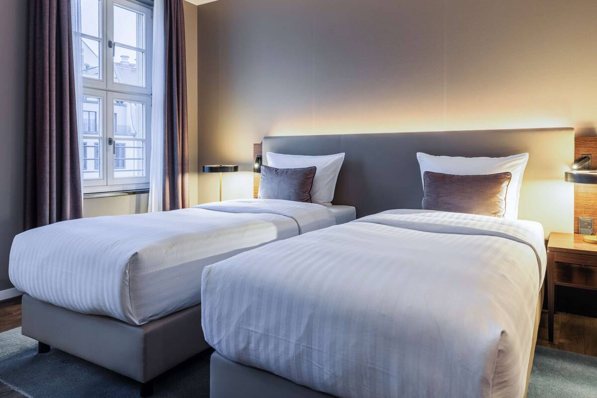 superior twin room | hypo-allergenic bedding, down duvets, in-room safe, desk