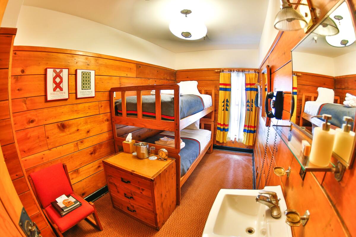 Bunk Room with Shared Bathroom | Down comforters, pillowtop beds, in-room safe, individually decorated