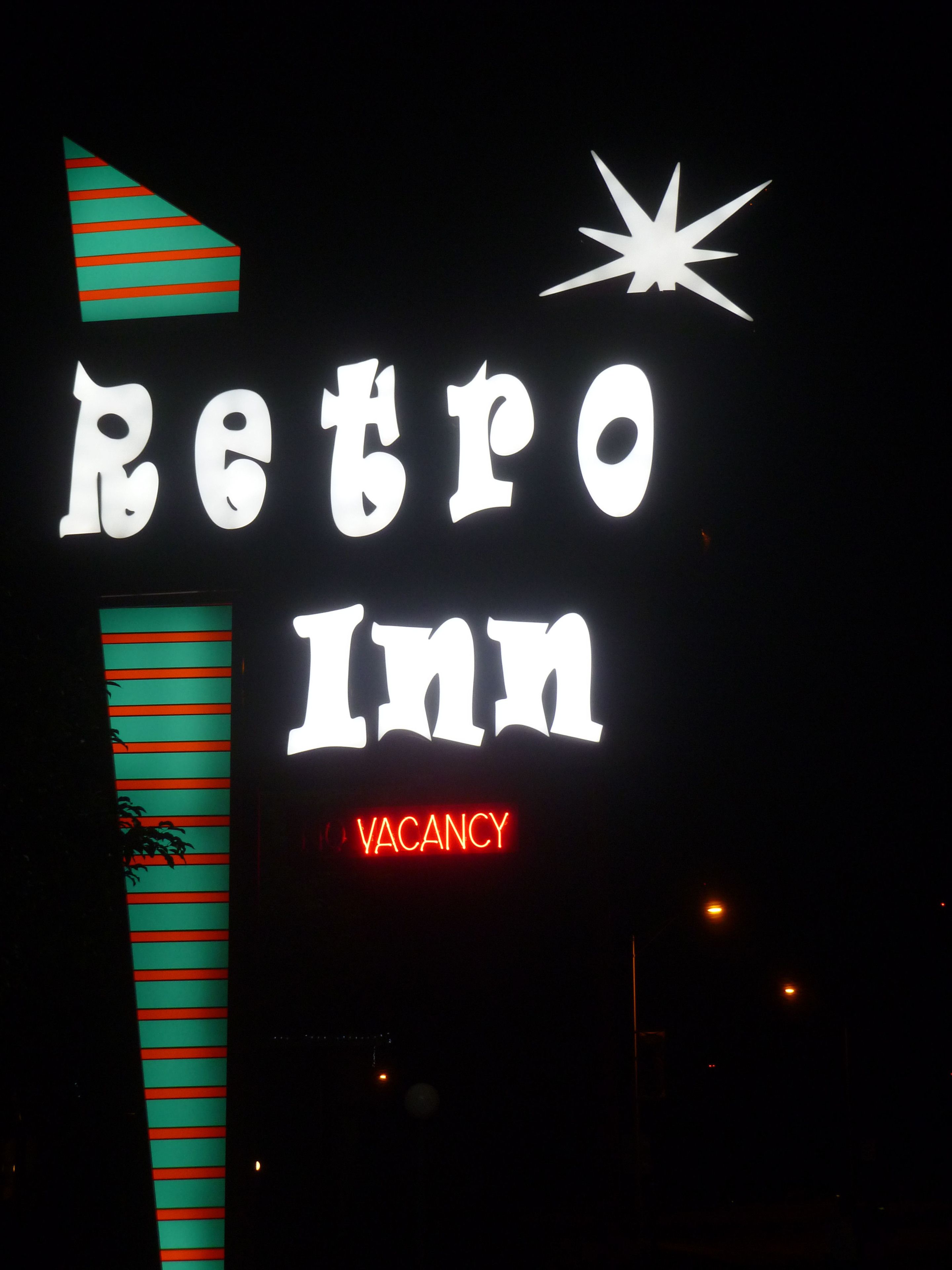 A neon sign for a Retro Inn with a 'VACANCY' indication.
